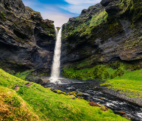 Colorful morning view of Kvernufoss waterfall.