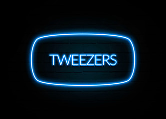 Tweezers  - colorful Neon Sign on brickwall