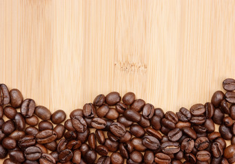 Coffee beans on a wooden background