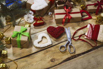 The process of packaging and packaging New Year's gift box.Scissors, ribbons, ornaments