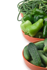 green peppers, cucumbers and garlic in a bowl