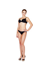 Fototapeta premium Full portrait of sexy lady in black lingerie, isolated on white background