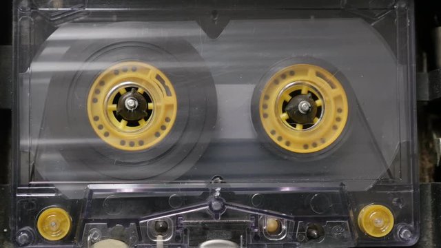  Retro audio cassette played in casettophone close-up  footage - Music player supply spindle rotating