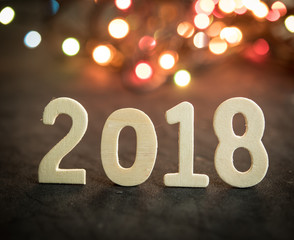 New year 2018,word of 2018 with blurred color lights bokeh bacground