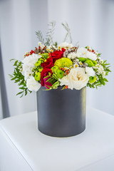 Bouquet of multicolored flowers roses in luxury gift box