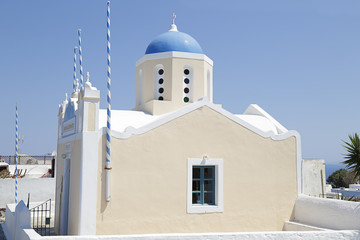 Greek ortodox church with bell tower on Santorini island in Aegean sea, Oia village, Greece