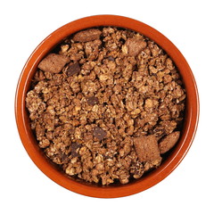 Crunchy granola, muesli pile with chocolate isolated on white background, top view