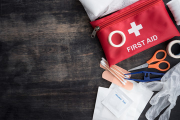 First aid medical kit on wood background,copy space,top view