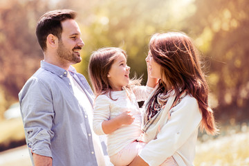 Obraz premium Happy family having fun outdoors.