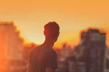 Man on the sunset background.