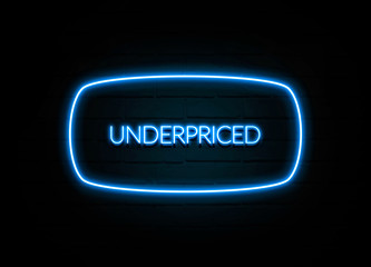Underpriced  - colorful Neon Sign on brickwall