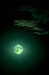 full green fantastic moon in the sky with clouds, moonlight.