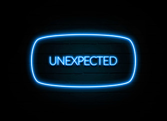 Unexpected  - colorful Neon Sign on brickwall