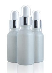 Serum essence bottle with pipette isolated on white background