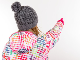 Young girl pointing with her finger