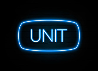 Unit  - colorful Neon Sign on brickwall