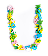 Colorful wood alphabet letters on a white background,font letter U