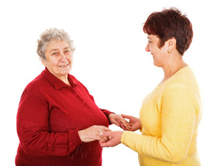 Elderly woman and young caregiver