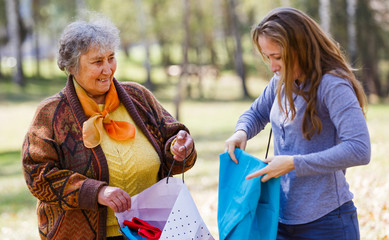 Happy elderly woman with her daughter