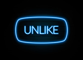 Unlike  - colorful Neon Sign on brickwall