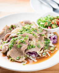 Spicy stir fried pork stips with pepper chilli on wood,thai food