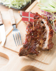 BBQ Pork Spare Ribs on wood plate.