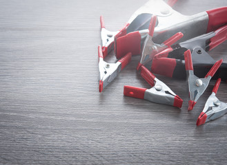 spring clamp on wooden background