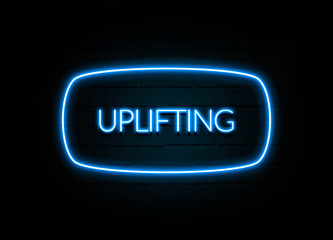 Uplifting  - colorful Neon Sign on brickwall