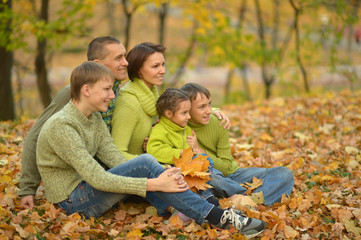 family in autumn forest