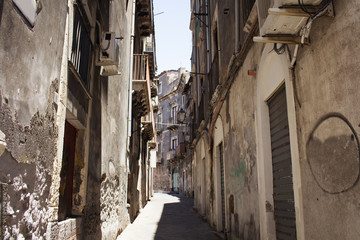 View of typical, narrow street in Catania city of Sicily region of Italy reflecting architectural style and culture.