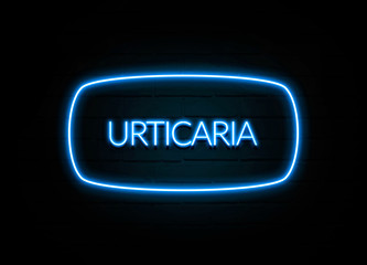 Urticaria  - colorful Neon Sign on brickwall