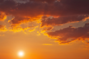 Beautiful fiery orange sunset sky as background