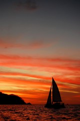 Fototapeta na wymiar Sailing during a sunset