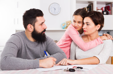 Father and mother preparing divorce papers