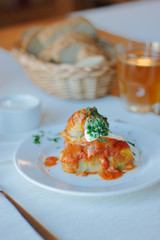 Delicious cabbage rolls on white plate in restaurant.