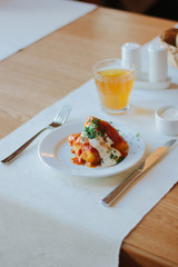Delicious cabbage rolls on white plate in restaurant.
