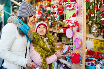 Female customers staring at counter of Christmas market