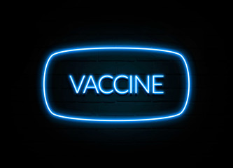 Vaccine  - colorful Neon Sign on brickwall