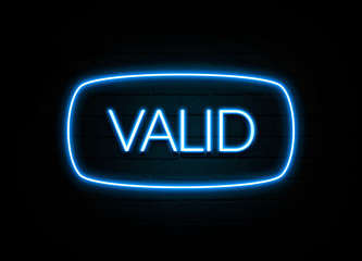 Valid  - colorful Neon Sign on brickwall