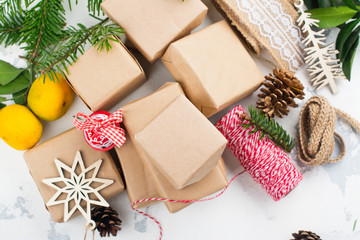 Many Christmas gift boxes. Christmas presents ready for wrapping with decor on white holiday background. Copy space