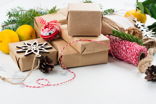 Many Christmas gift boxes. Christmas presents ready for wrapping with decor on white holiday background. Copy space