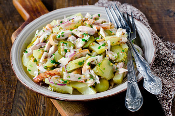 Potato salad with chicken and pickled cucumbers
