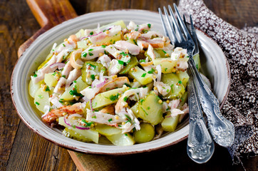 Potato salad with chicken and pickled cucumbers