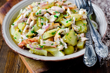 Potato salad with chicken and pickled cucumbers