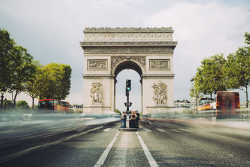 Famous avenue Champs-Elysees and the Triumphal Arch, symbol of the glory and historical heritage....