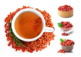 Composition with goji tea on white background