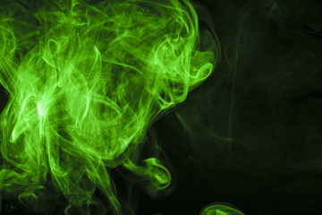 Green smoke on black background