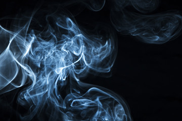 Fototapeta premium Blue smoke on black background