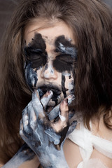 Teenager girl with Mummy bandages on Halloween