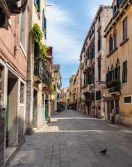 Narrow street in the old town in Venice Italy